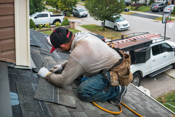Professional Roof Replacement technician working in Riley, IN